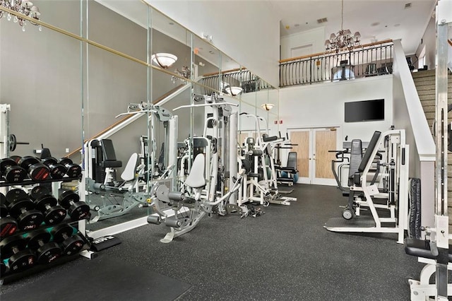 3777 Peachtree Rd NE Unit 1227, Brookhaven, GA 30319 - exercise room featuring a high ceiling and a chandelier