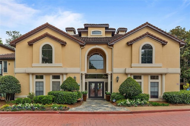 3777 Peachtree Rd NE Unit 1227, Brookhaven, GA 30319 - mediterranean / spanish-style home featuring french doors, stucco siding, and a tile roof