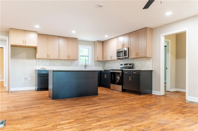 45 Driskell Ave, Mableton, GA 30126 - kitchen with appliances with stainless steel finishes, light wood finished floors, light countertops, decorative backsplash, and recessed lighting