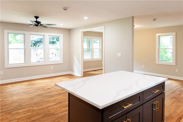 45 Driskell Ave, Mableton, GA 30126 - kitchen with light wood-style flooring, light countertops, ceiling fan, a center island, and recessed lighting