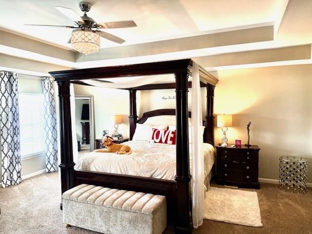 558 Hideaway Dr, Jonesboro, GA 30238 - carpeted bedroom with baseboards and a ceiling fan