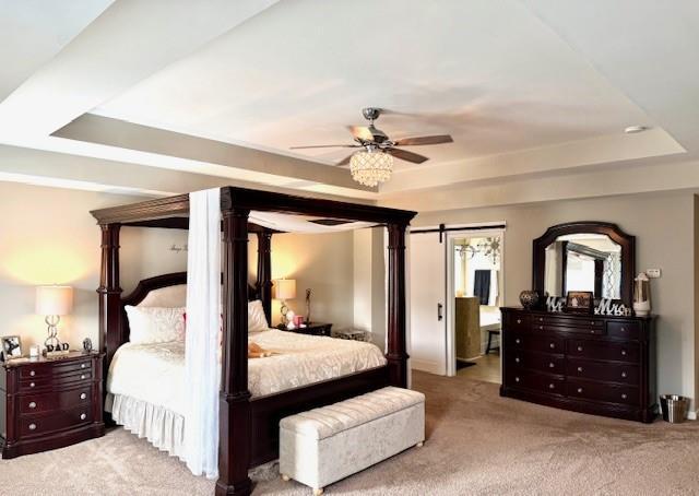 558 Hideaway Dr, Jonesboro, GA 30238 - bedroom with a raised ceiling, carpet, and ceiling fan