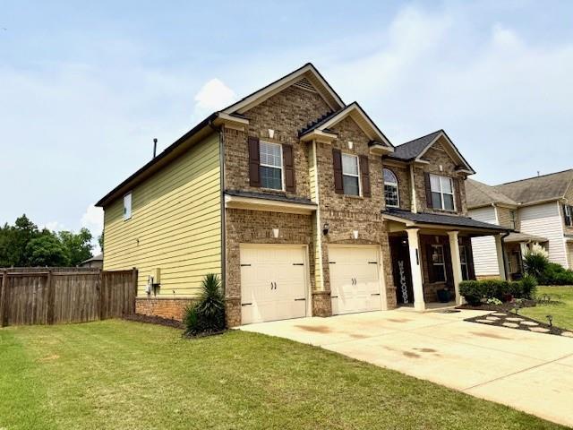 558 Hideaway Dr, Jonesboro, GA 30238 - craftsman-style house featuring concrete driveway, a garage, and brick siding
