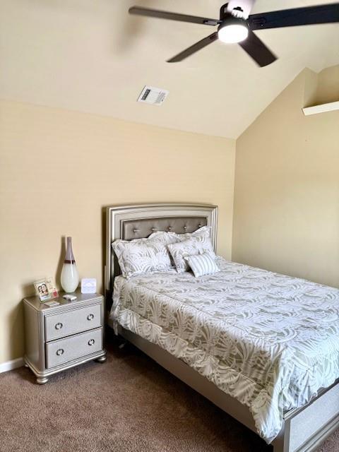 558 Hideaway Dr, Jonesboro, GA 30238 - carpeted bedroom with lofted ceiling and ceiling fan