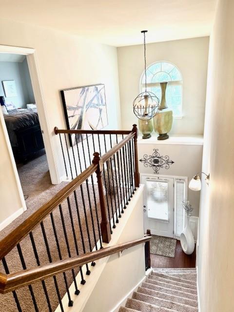 558 Hideaway Dr, Jonesboro, GA 30238 - stairway with a chandelier