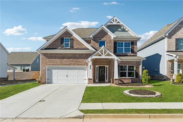 craftsman-style house with a garage, a front lawn, brick siding, and concrete driveway