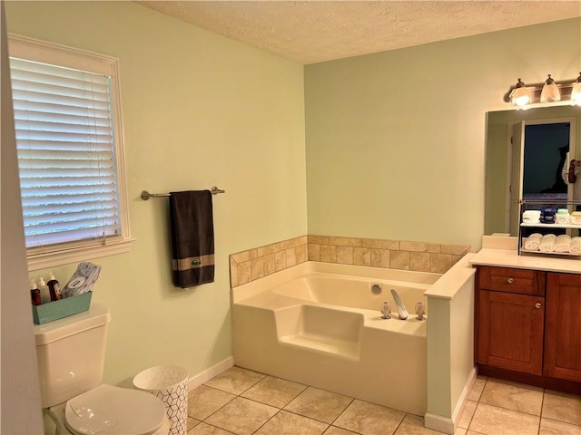 403 Hickory Walk, Woodstock, GA 30188 - bathroom featuring a garden tub, tile patterned floors, vanity, toilet, and a textured ceiling