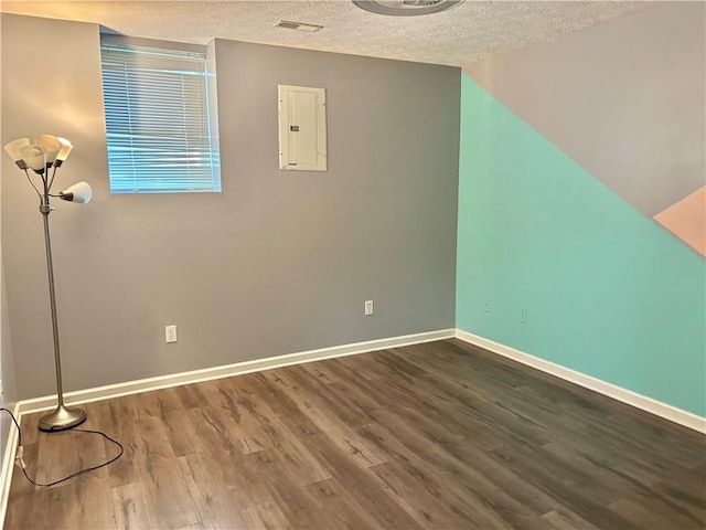 403 Hickory Walk, Woodstock, GA 30188 - bonus room featuring electric panel, a textured ceiling, wood finished floors, and baseboards