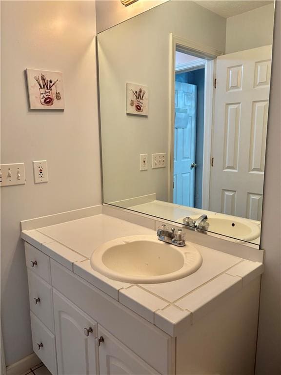 403 Hickory Walk, Woodstock, GA 30188 - bathroom with vanity and baseboards
