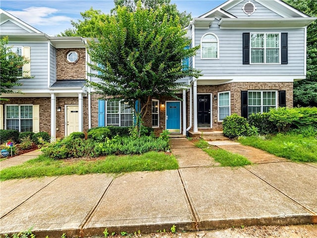 multi unit property featuring brick siding