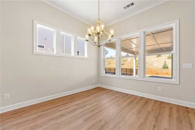 198 Bear Way, Hoschton, GA 30548 - empty room featuring a chandelier, crown molding, light wood-type flooring, and baseboards