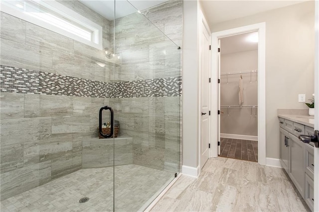 bathroom with vanity and an enclosed shower