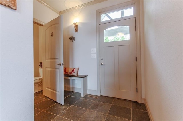 foyer entrance featuring ornamental molding