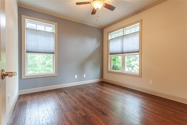 empty room featuring ceiling fan, dark wood-type flooring, and crown molding