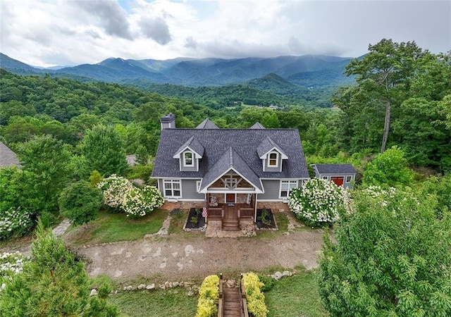 exterior space featuring a deck with mountain view