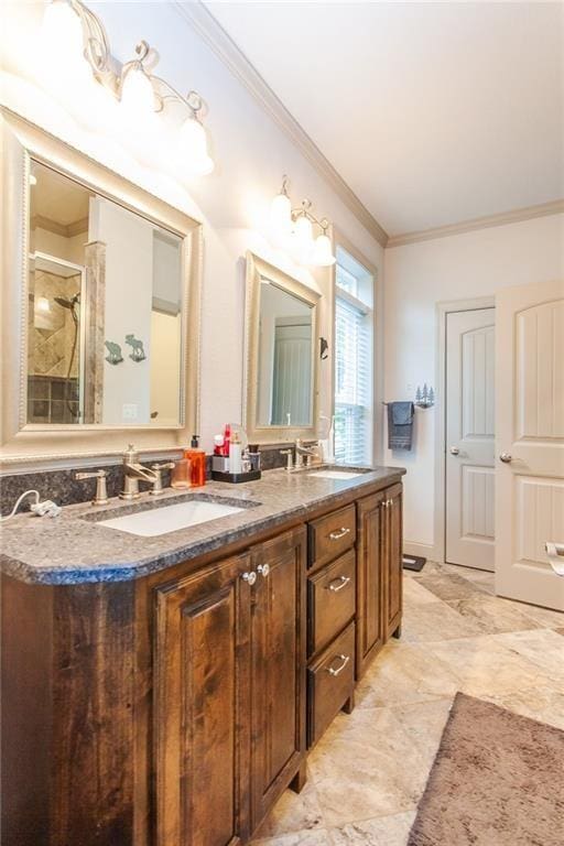 bathroom featuring crown molding, vanity, and a shower with shower door