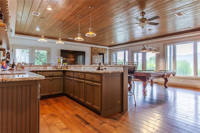 kitchen featuring wooden ceiling, ceiling fan, pendant lighting, and dark wood-type flooring