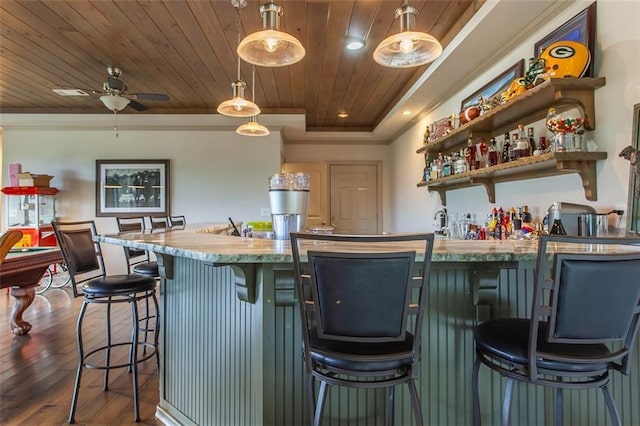 kitchen with pendant lighting, wooden ceiling, wood-type flooring, a kitchen bar, and ceiling fan