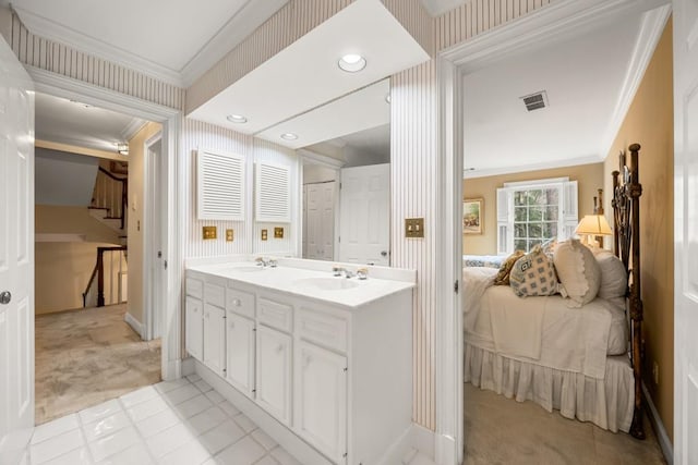 bathroom with ornamental molding and vanity