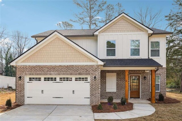 craftsman-style home featuring brick siding, concrete driveway, and a garage
