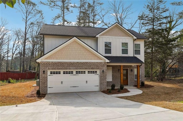 craftsman-style house with driveway, fence, roof with shingles, a garage, and brick siding