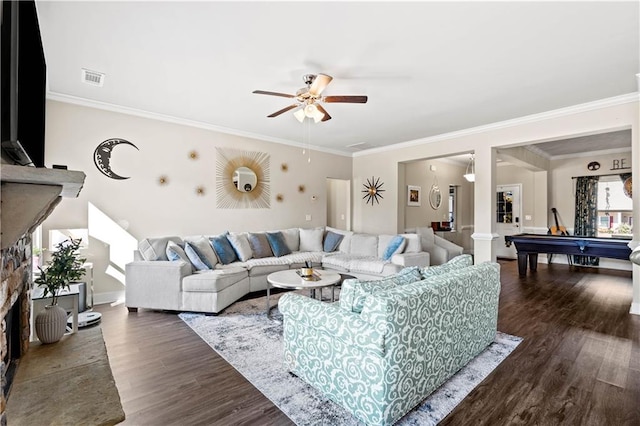 living room featuring ceiling fan, ornamental molding, and dark hardwood / wood-style flooring