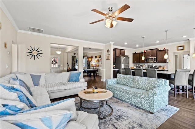 living room featuring ornamental molding, ceiling fan, sink, and dark hardwood / wood-style flooring