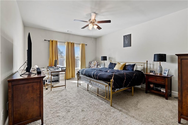 bedroom with light carpet and ceiling fan