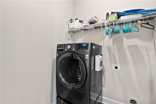 washroom with washer / clothes dryer