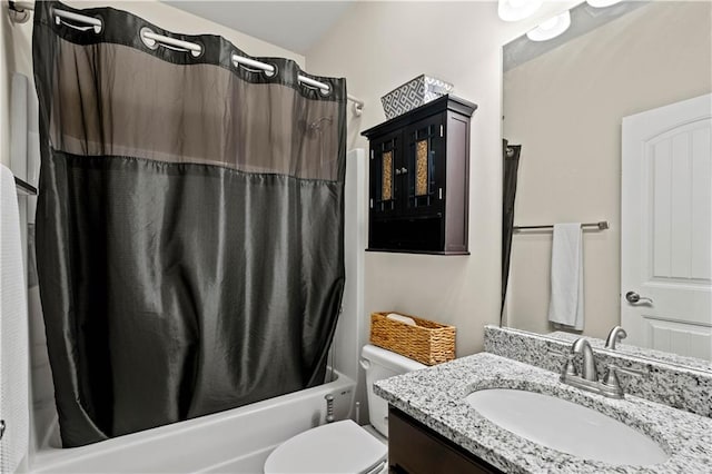 full bathroom with vanity, shower / tub combo with curtain, and toilet