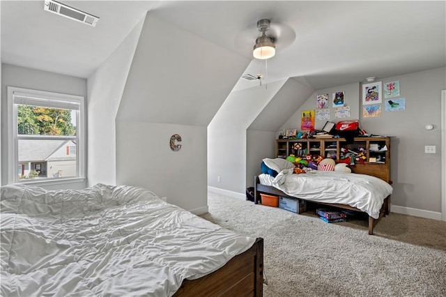 bedroom featuring lofted ceiling, carpet floors, and ceiling fan