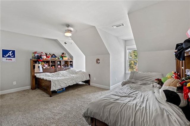 bedroom with light carpet and lofted ceiling