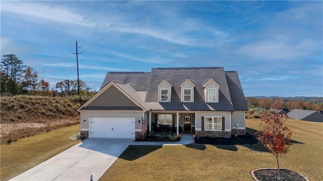 cape cod home with a front yard and a garage