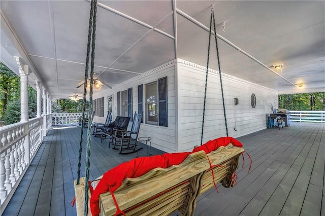 wooden terrace featuring covered porch