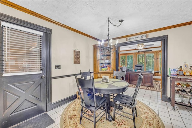 dining space featuring crown molding, a textured ceiling, light tile patterned floors, and ceiling fan with notable chandelier