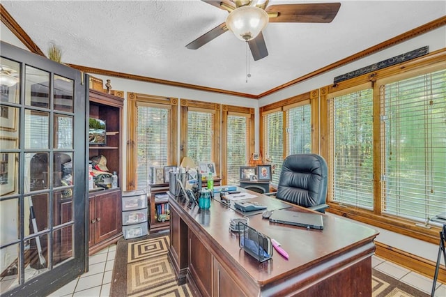 tiled office space with ornamental molding, a textured ceiling, and ceiling fan