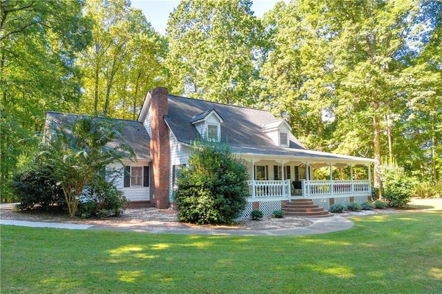 view of front of home featuring a front yard and a porch