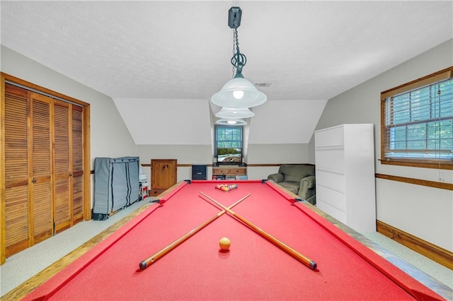 rec room with pool table, plenty of natural light, and vaulted ceiling