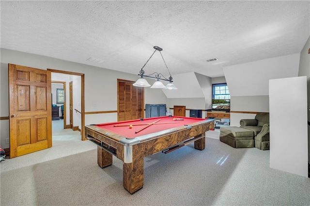 recreation room featuring pool table, a textured ceiling, light carpet, and vaulted ceiling