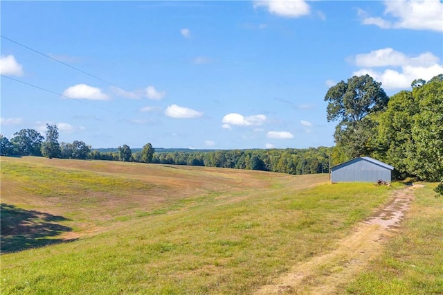 view of yard with a rural view