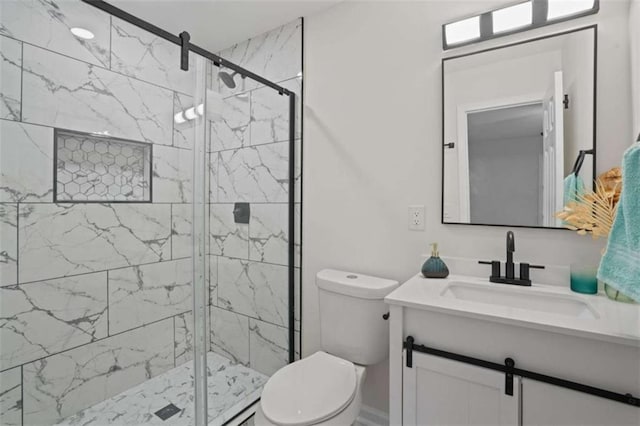 bathroom with toilet, a shower with shower door, and vanity