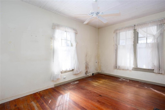 spare room featuring hardwood / wood-style flooring and ceiling fan