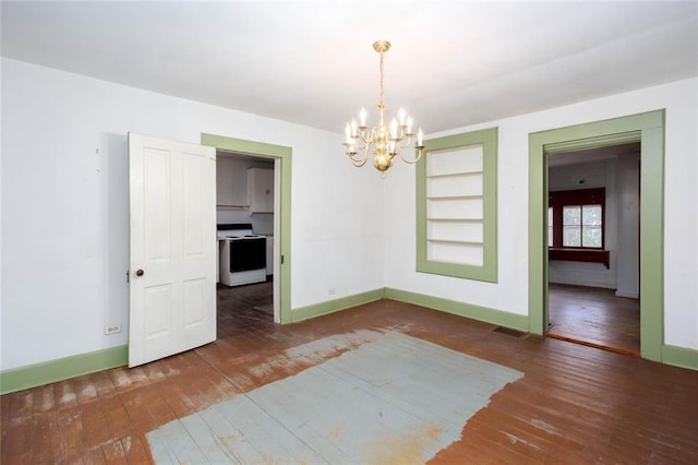 unfurnished dining area with a notable chandelier, built in features, and dark hardwood / wood-style floors