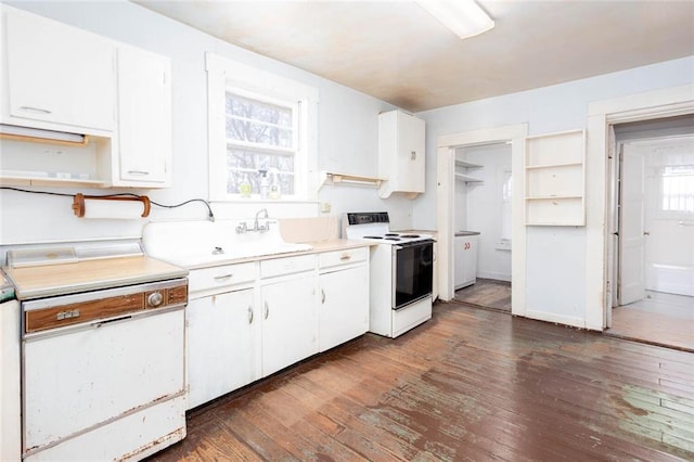 kitchen with white appliances, dark hardwood / wood-style flooring, sink, and white cabinets