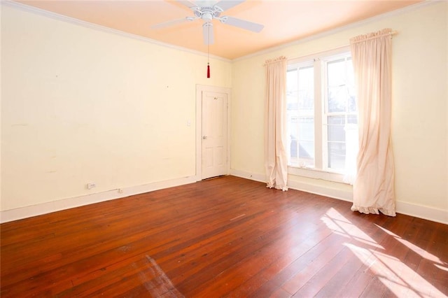 spare room with crown molding, ceiling fan, and dark hardwood / wood-style floors