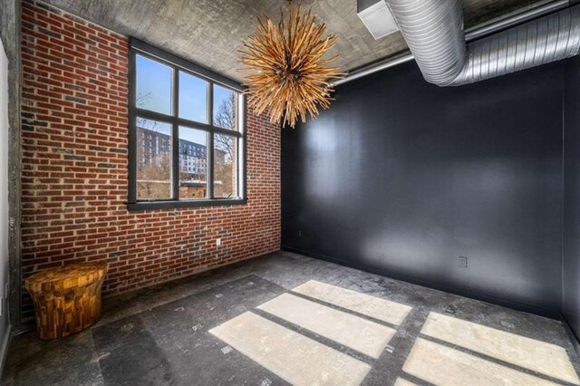 empty room with brick wall