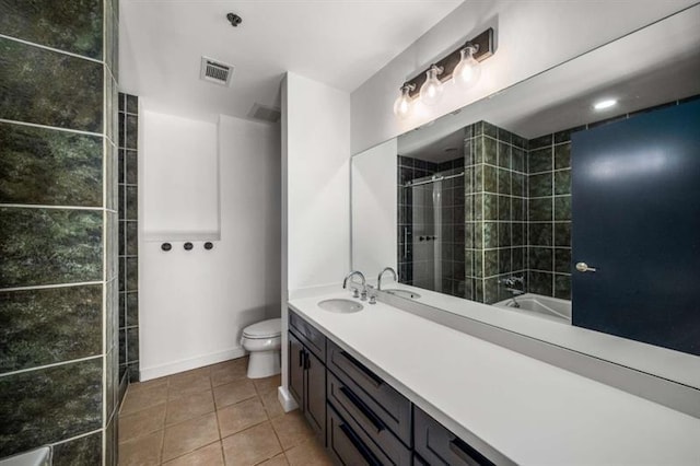 full bath featuring tile patterned flooring, toilet, visible vents, vanity, and a tile shower