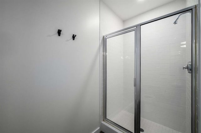 bathroom featuring a shower stall