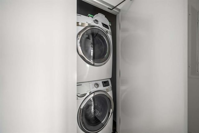 laundry area with laundry area and stacked washing maching and dryer