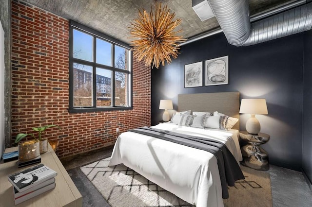bedroom featuring brick wall